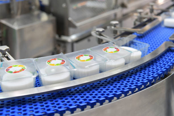 istock Food products box transfer on Automated conveyor systems industrial 1436993202