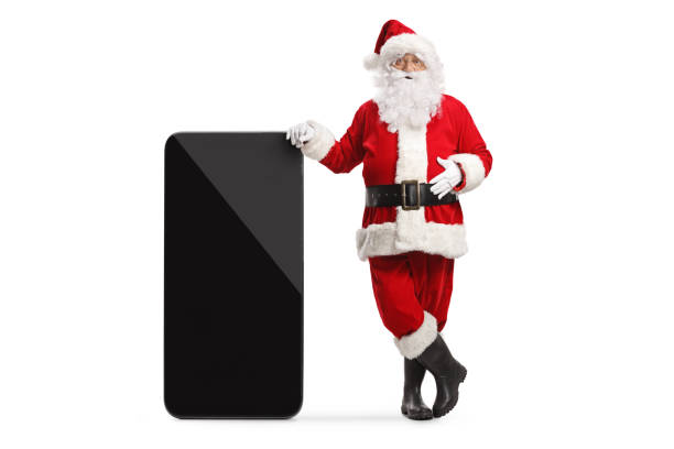 istock Santa claus leaning on a big mobile phone 1436993740