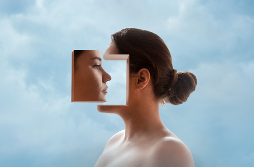 Image montage of young woman's profile with cut out and inverted part of face.
Concept: self research, self-talk, self analysis, inner dialogue, inner communication, etc.