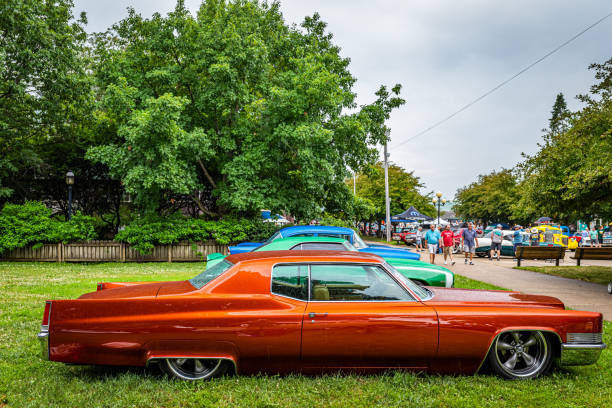 Des Moines, IA - July 01, 2022: High perspective side view of a 1969 Cadillac Coupe DeVille at a local car show.