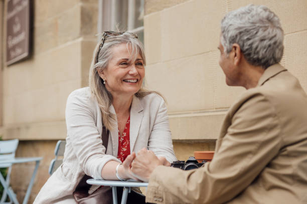 istock Affectionate Couple Sitting at a Cafe 1436999078
