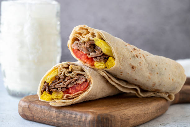 Turkish meat doner wrap on gray background. Traditional flavors. Doner kebab made from beef and lamb. close up stock photo