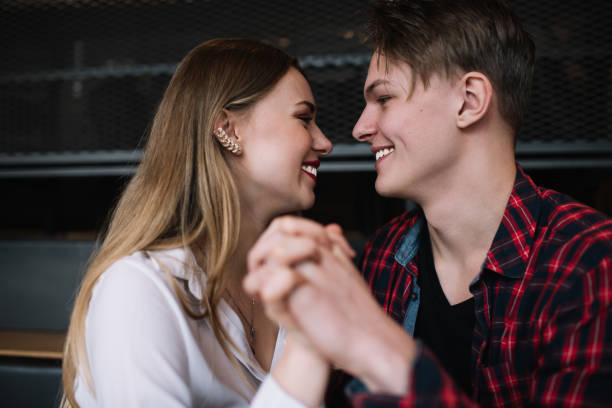 istock Loving young couple hugging in cafe 1437000364