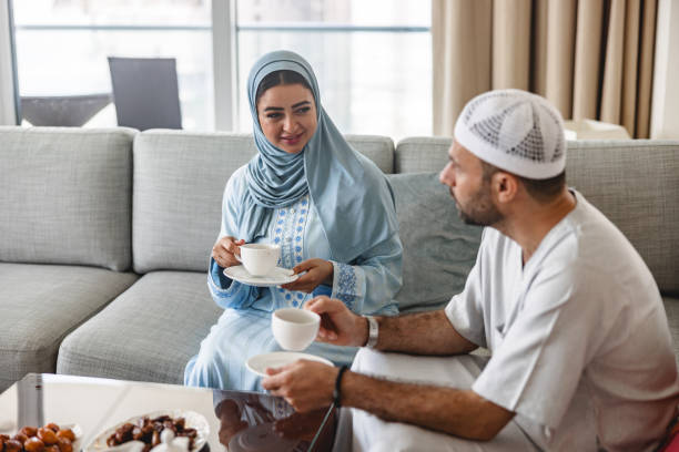 istock Middle Eastern Brother And Sister Chats While Drinking Tea In The Living Room 1437003044
