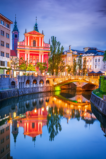Ljubljana, Slovenia. Triple Bridge, Tromostovje water reflection on Ljubljanica river, slovenian travel background.