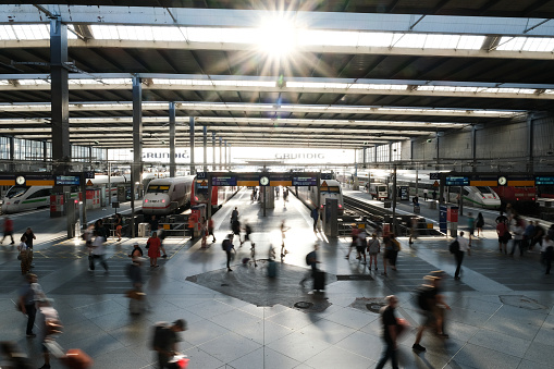 Passenger walk on a platform after a commuter train arrived  at Munich Central Station in Germany on July 25, 2022.