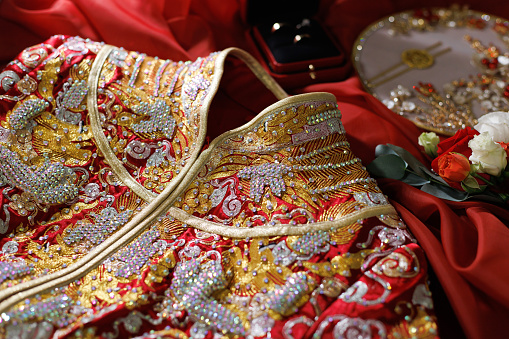 Traditional Chinese bride's wedding dress details close up