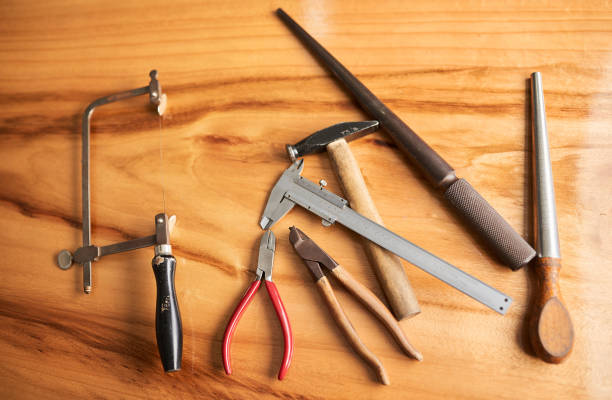 Jewelry design tools, vintage goldsmith and creative toolkit on table from top view. Jeweler industry hand instruments, professional handcraft designer equipment and basic ring production set