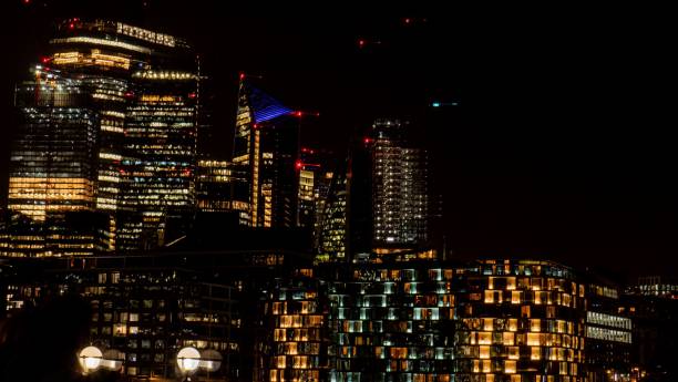 istock Skyline illuminated at night with a dark background. 1437011070