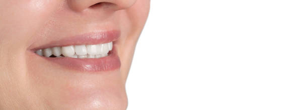 istock Happy smile with white teeth isolated on white background macro close up view 1437016402