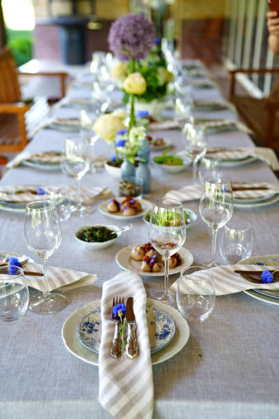 istock beautiful setting of a large table with snacks and flowers. 1437017500