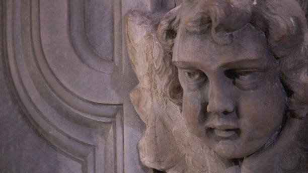 istock Angel head carved in stone ancient fountain 1437017846