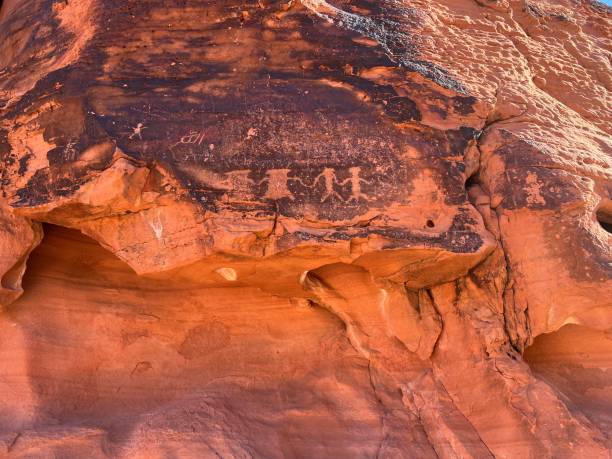 istock Vertical shot of ancient engravings on a red cliff 1437024947