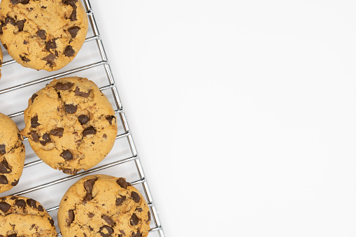 Some american cookies on an oven rack with white copy space