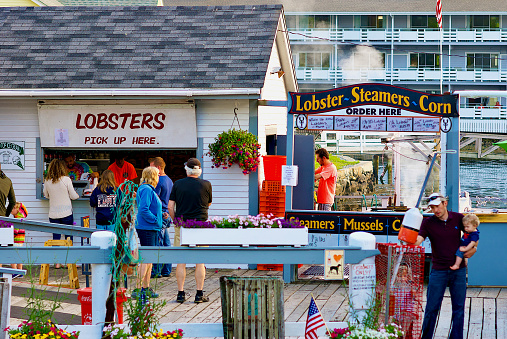 Boothbay Harbor, Maine, USA - Diners pick up their freshly-steamed lobsters and steamed seafood at the \