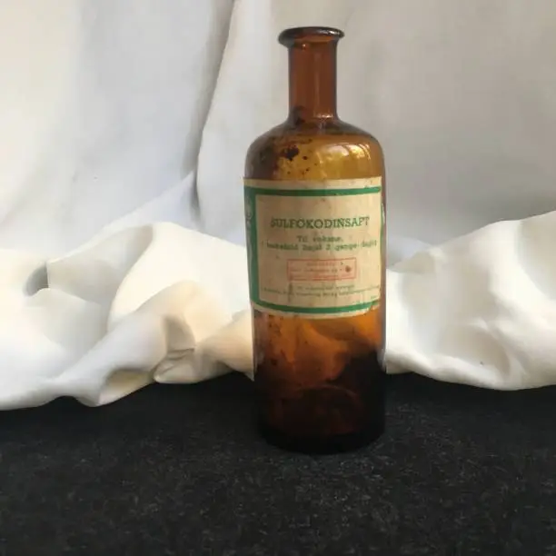 Antique medicine amber glass bottle