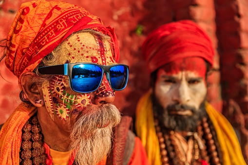 In Hinduism, sadhu, or shadhu is a common term for a mystic, an ascetic, practitioner of yoga (yogi) and/or wandering monks. The sadhu is solely dedicated to achieving the fourth and final Hindu goal of life, moksha (liberation), through meditation and contemplation of Brahman. Sadhus often wear ochre-colored clothing, symbolizing renunciation.