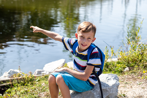 Boy and a duck near Bylsjön in Tyresta national park