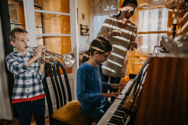 istock Children playing music together 1437038717