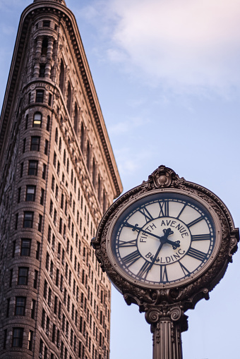 New York City, USA - March 30, 2015 : Flatiron building and clock at midtown