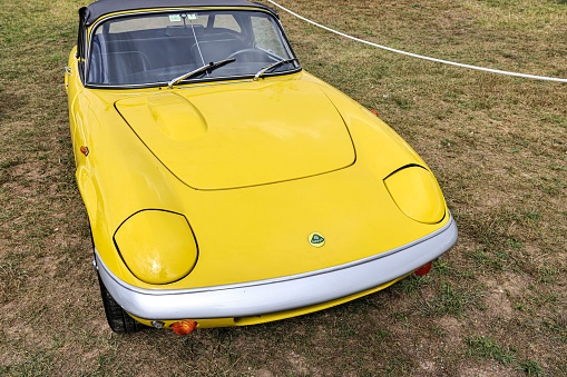 leiria, Portugal – October 16, 2022: A closeup of details of yellow vintage historic Lotus Elan Sprint convertible classic car