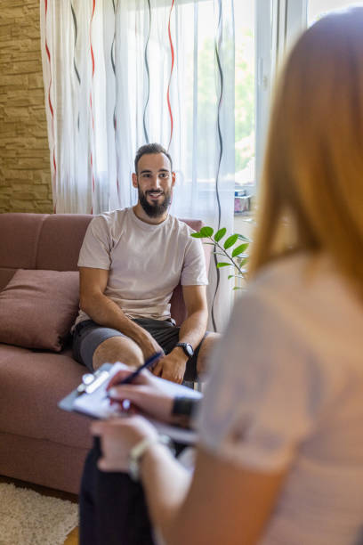 istock Man talking whit psychologist in the office 1437040269