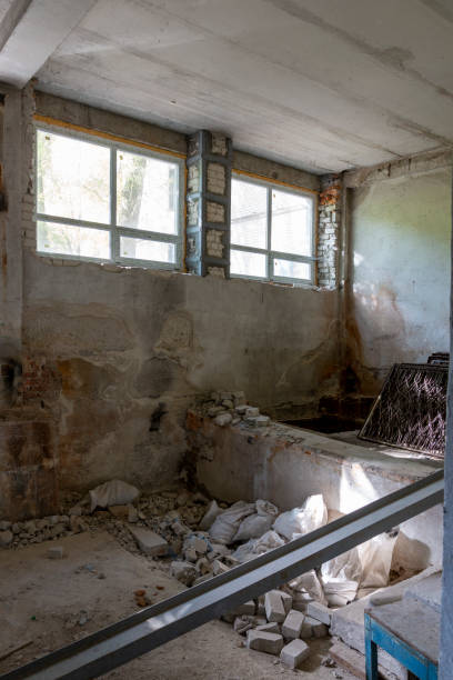 istock Broken floor, trash and clutter in an abandoned room 1437043731