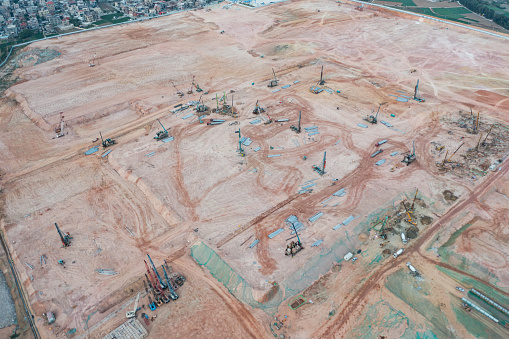 Aerial view of large construction site at dusk