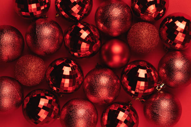 istock Christmas card with red balls on red background 1437051719