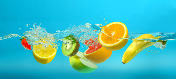 istock Fruits mix splashing into clear water on turquoise blue background 1437052143