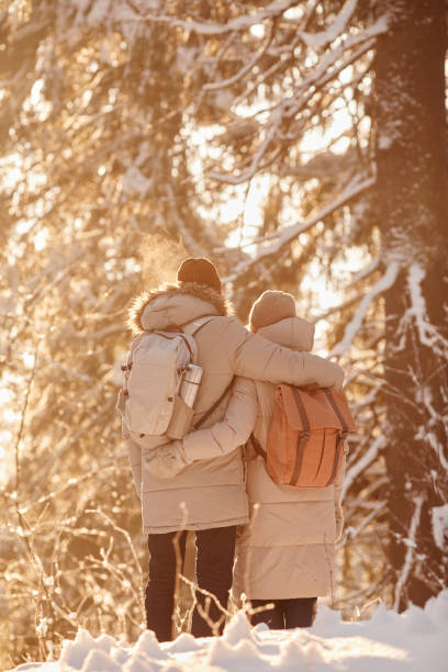 istock Senior Couple Enjoying Winter Hike in Sunlight 1437052344