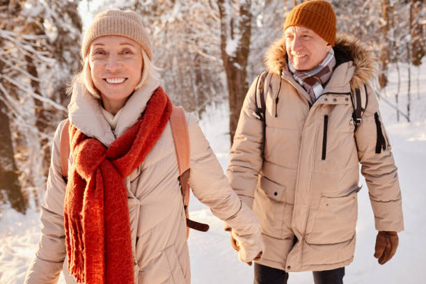 istock Smiling Senior Couple Walking in Winter 1437052349