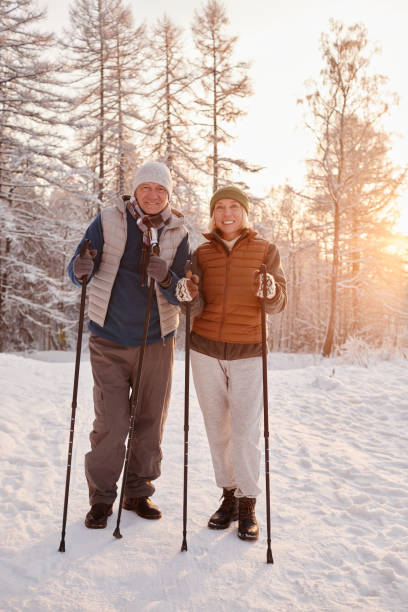 istock Active Senior Couple in Winter Forest 1437052374