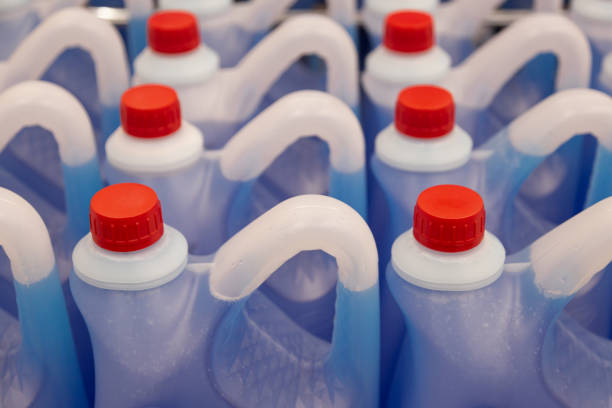 istock Blue Windshield washer fluid, Professional Refill Blue color, chemicals in plastic bottles cans in the warehouse store. Antibacterial Liquid Wash in plastic canisters with red plastic cork cap. 1437054160