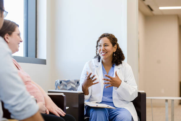 istock Hospital admin meets with expectant mother 1437054222