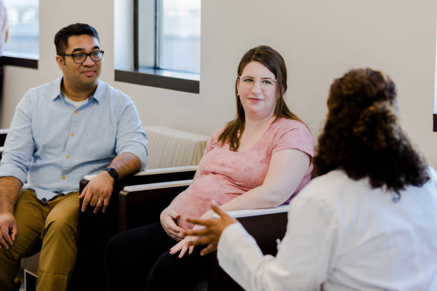 istock Husband and wife meet with doctor 1437054230
