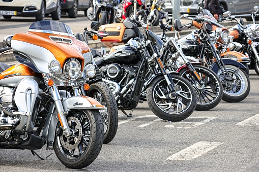 Leiria, Portugal – October 16, 2022: The classic Vespa, Harley Davidson, Famel XF, Piaggio, and Sachs V5 motorcycles on display on a street