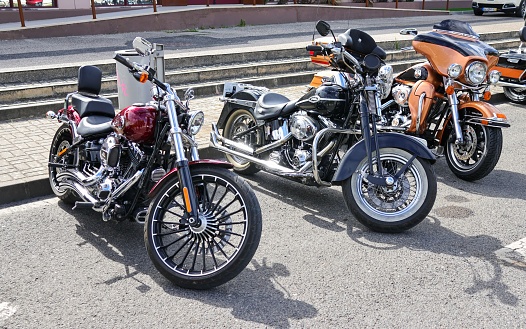Leiria, Portugal – October 16, 2022: A row of classic Harley Davidson motorcycles parked on a road on display