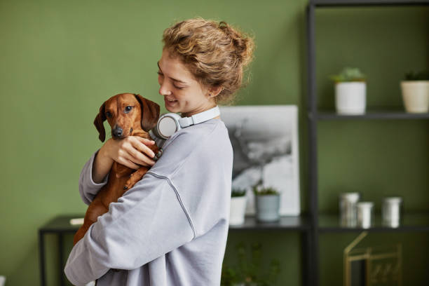 istock Girl playing with her dog 1437056217
