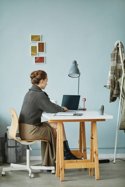 istock Woman working on laptop at office 1437056282
