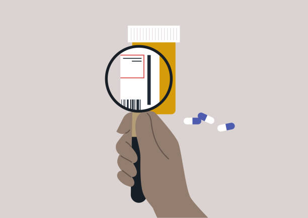 A plastic orange prescription drugs container with white and blue pills, a magnifying glass zooming in on the label A plastic orange prescription drugs container with white and blue pills, a magnifying glass zooming in on the label vitamin a nutrient stock illustrations