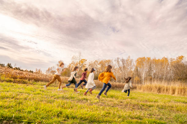 istock Children Running Across a Field 1437057625