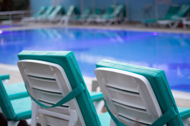 istock empty and clean pool environment and tidy sunbeds 1437063433