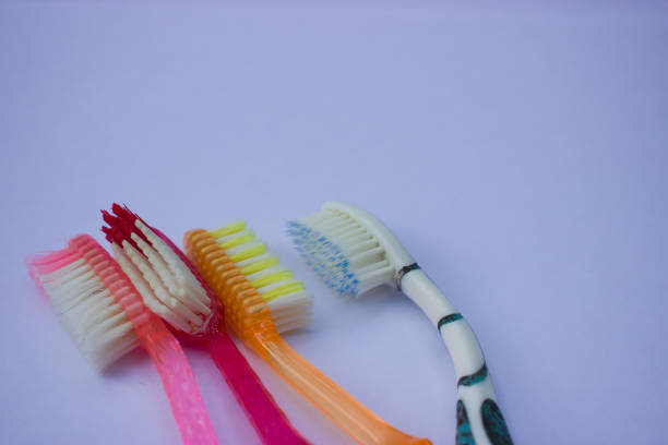 used toothbrush on gray background