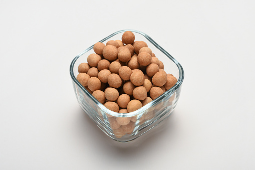 Roasted crispy chickpeas in a bowl on the white background