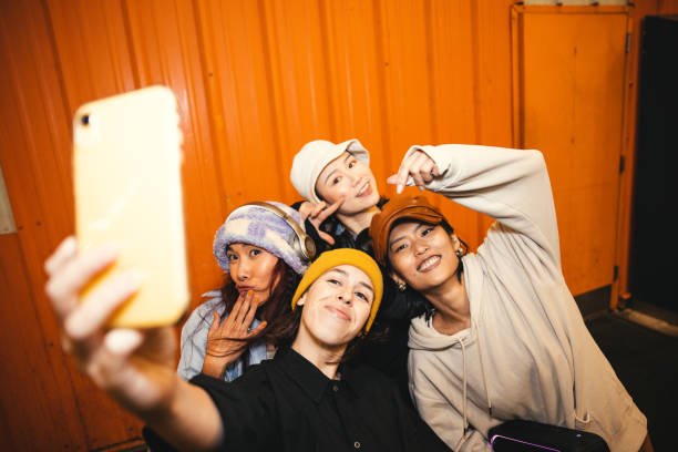 istock Four female friends taking a selfie 1437067359