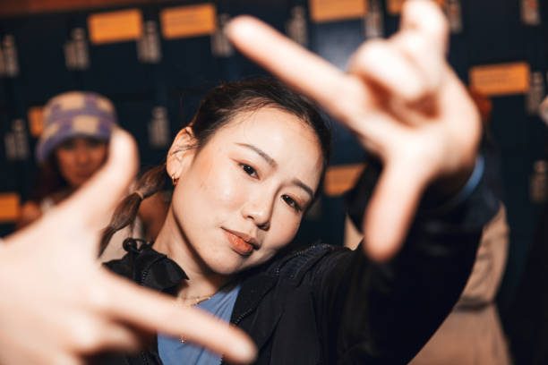 istock Taiwanese woman showing a picture frame to camera 1437067464