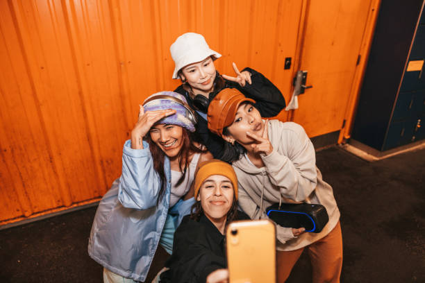 istock Four female friends taking a selfie 1437068082