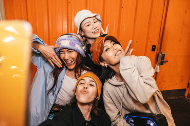 Group of four urban style friends take a selfie in New York.
