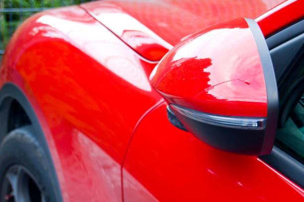 istock Close up of red car wing mirror. 1437070986